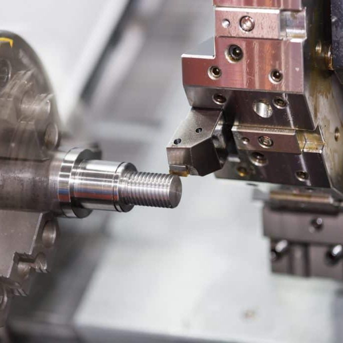 machining automotive part by cnc turning machine Operator machining automotive part by cnc turning machine